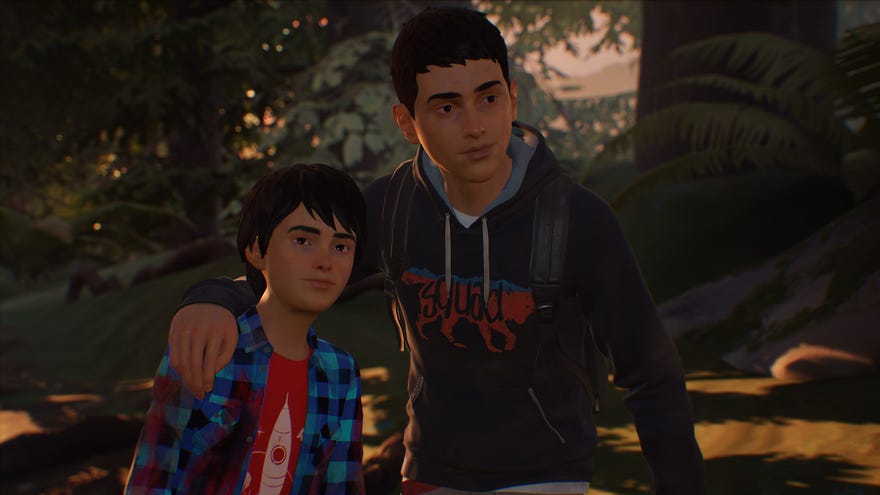 The protagonists of Life Is Strange 2 in a close-up against a forest background. Older brother Sean has his arm around younger brother Daniel, and both are smiling slightly.