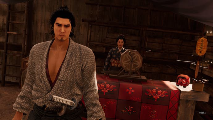 Like a Dragon Ishin, Ryoma is standing by the Prize Wheel stall