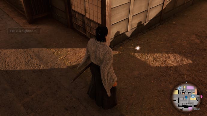 Like a Dragon Ishin, Ryoma is facing a glowing object on the ground
