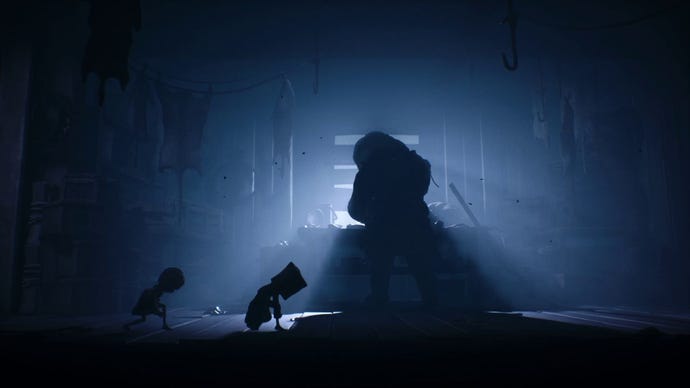 A screenshot from Little Nightmares II showing Six and Mono creeping behind the silhouette of a large man, who is skinning animals at a table in front of a boarded up window