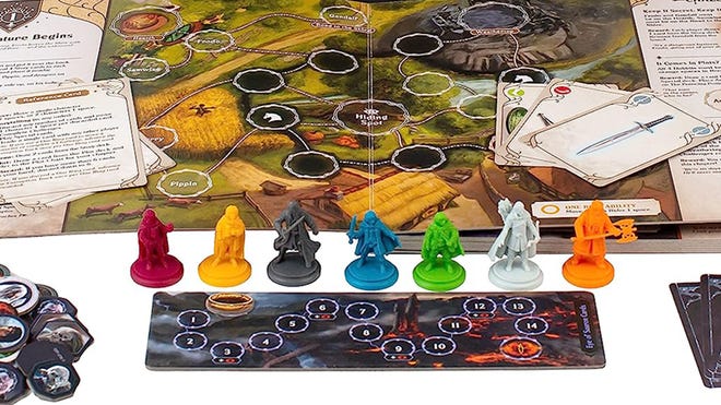 An image of the components for The Lord of the Rings: Adventure Book Game.