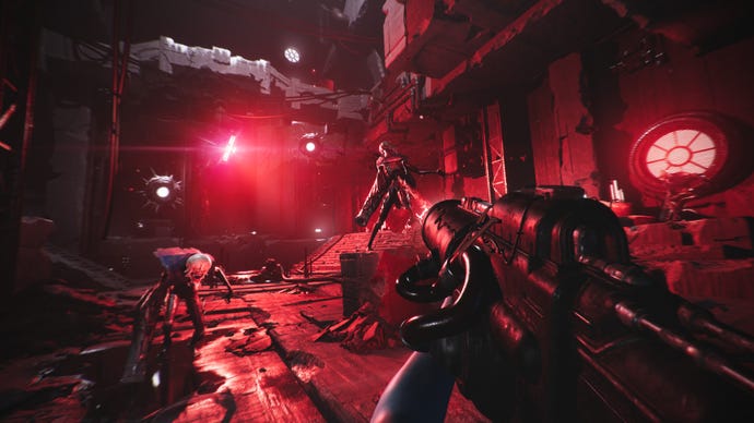 The player aims a gun down a corridor of red light in Luna Abyss