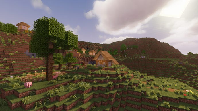 Krajobraz Minecraft Extreme Hills z drzewem na pierwszym planie i wioską w tle