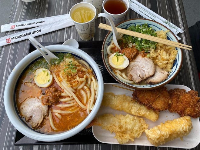 Photograph of an udon bowl, rice bowl, and tempura on a tray