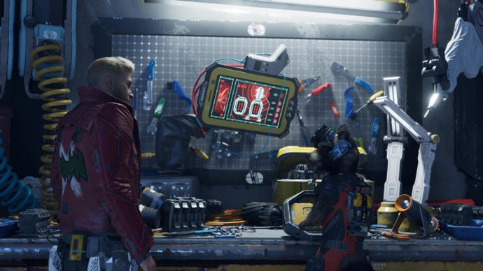 Star Lord and Rocket share a conversation over a workbench.