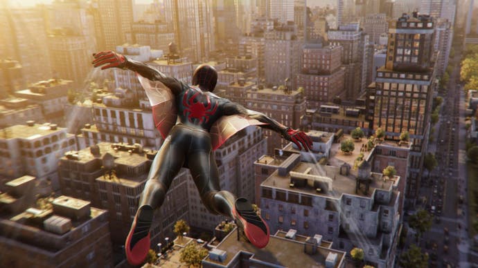 Miles Morales uses his web-wings to keep him aloft about New York City, which is blazing with evening sunlight, in this shot from Spider-Man 2