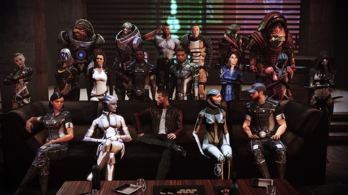 The entirety of Shepard's crew across the Mass Effect trilogy all sit around a couch together.
