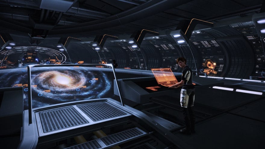 A first-person view of the CIC in Mass Effect 2. You can see the galaxy map and Yeoman Kelly.