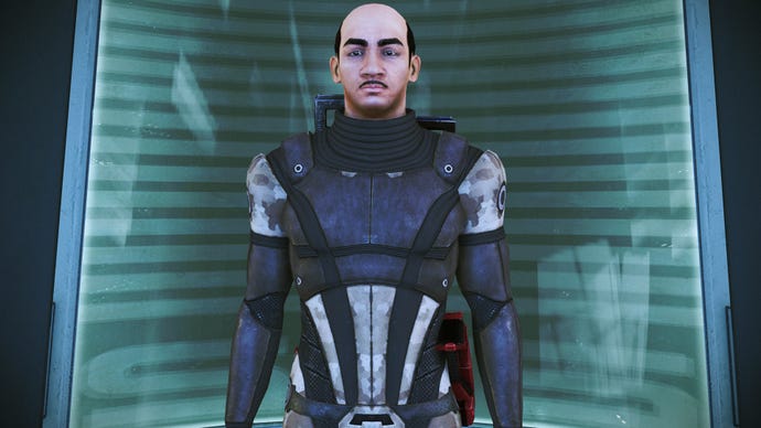 Commander Shepard from Mass Effect Legendary Edition waiting patiently in the elevator. Shepard also looks an awful lot like Hercule Poirot, as played by David Suchet.
