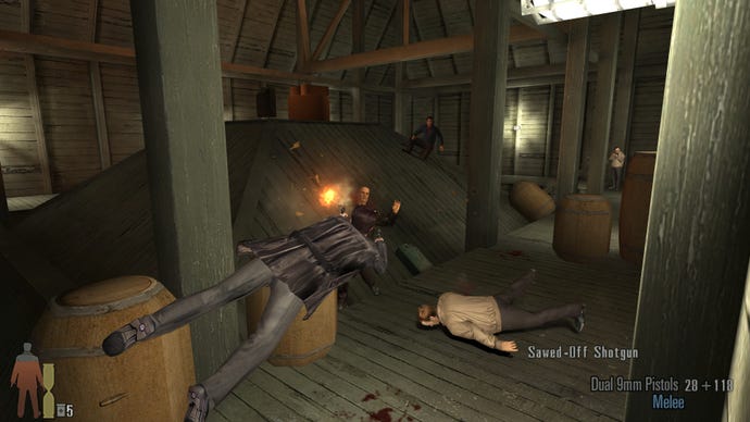 Max Payne guns down baddies during a sideways dive in a Max Payne 2 screenshot.