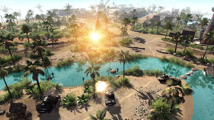 A battlefield in Men Of War - a desert with a river running through it, surrounded by palm trees. There are industrial buildings in the distance