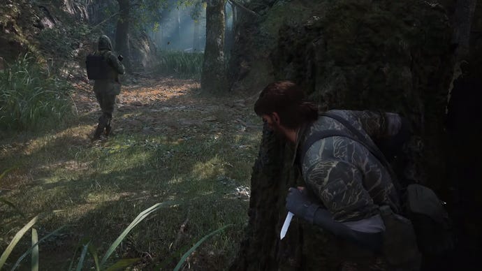 Naked Snake sneaks up behind a guard in the jungles of the Metal Gear Solid Delta: Snake Eater remake