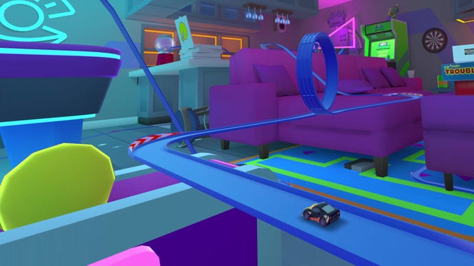 A racing track with a loop-the-loop runs through a living room in Micro Machines: Mini Challenge Mayhem