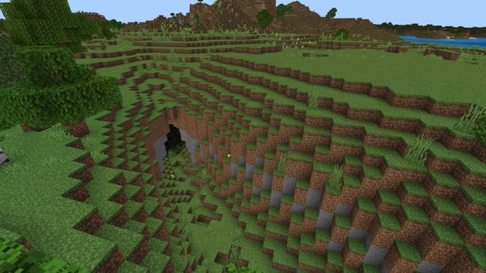 A Minecraft Bedrock plains biome, with a cave entrance in the foreground.