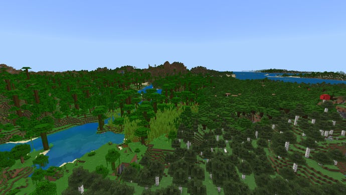 A forest-covered Minecraft Bedrock landscape, with Jungle on the left, birch forest on the right, and mountains in the background.