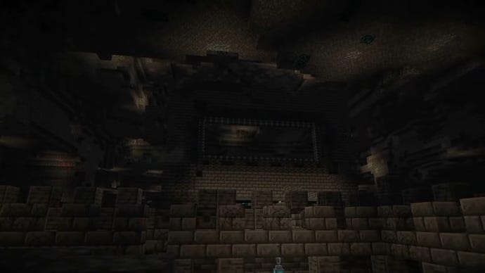 Screenshot van een diepe donkere stad in Minecraft