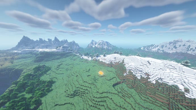 Un peisaj Minecraft de câmpii și copaci, cu munți acoperiți cu zăpadă în depărtare