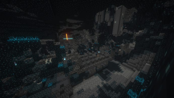 A large Ancient City in the Deep Dark biome in Minecraft, with a lavafall in the distance.