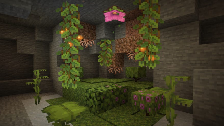 A Minecraft screenshot showing the new Cave Vines, Glow Berries, Moss, and other moist additions.