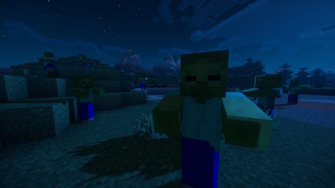 A nighttime Minecraft screenshot of a zombie looking at the player, with several more zombies wandering around in the background.