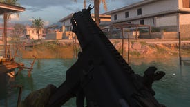 The player in Modern Warfare 2 inspects their weapon, the BAS-P SMG.