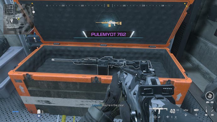 modern warfare 3 screenshot of an orange Warzone-style supply crate with a pimped out weapon in it