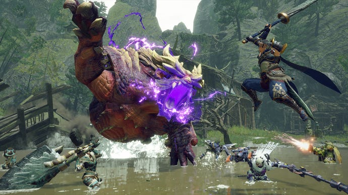 モンスターハンターは、数人の仲間の助けを借りて、大きな紫色の怪物と戦っているキャラクターを盛り上げます。