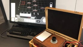 A custom telegraph controller next to a computer running MORSE