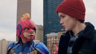 Ms Marvel trailer Iman Vellani as Kamala Khan in a Blue, Red, and Gold Ms Marvel costume facing Matt Lintz as Bruno Carrelli