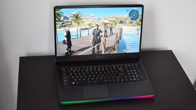 The MSI Raider GE76 (2022) gaming laptop on a table, running Final Fantasy XV.