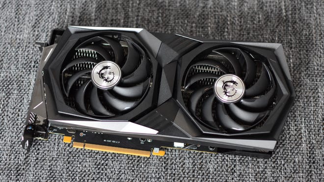 The MSI GeForce RTX 3050 Gaming X 8G graphics card, with the cooling fans facing upright.