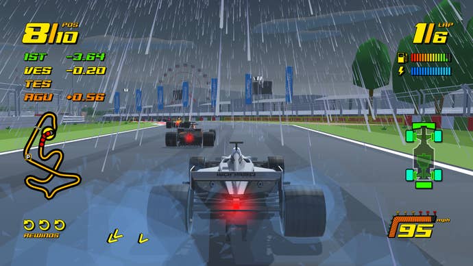 The cars in New Star GP race in the wet.