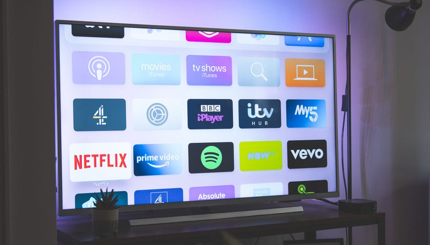 Photograph of a television featuring different streaming apps