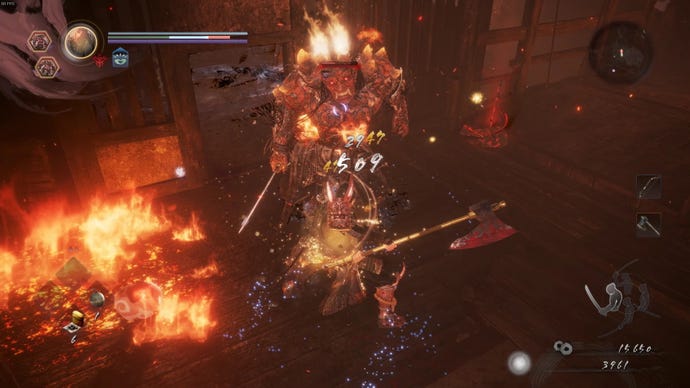 I swing my axe at a fiery, humanoid yokai. Fire spreads through the room we're in.