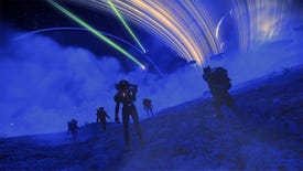 No Man's Sky - Several players walk across the surface of a desert planet at night, looking up at two starships flying past the planet's rings above.