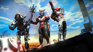Three No Man's Sky player characters stood next to each other, a blue sky covering the horizon.