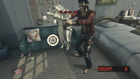 A screenshot of No More Heroes 2 showing protagonist Travis Touchdown standing in a grubby motel holding a large cat under its front legs.