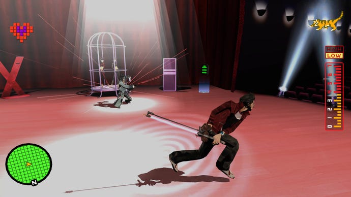 A screenshot from No More Heroes which shows Travis on a theatre stage, running around a flamboyant boss.