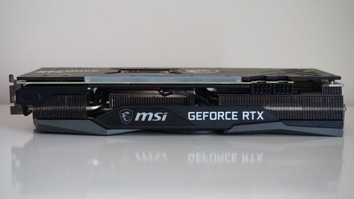 A side on photo of the MSI GeForce RTX 3060 Gaming X Trio graphics card, showing its two 8-pin power connectors