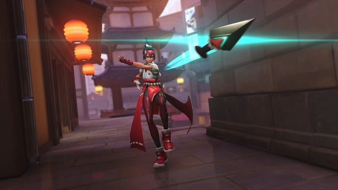 Kiriko, a hero in Overwatch 2, throws a kunai towards the camera in an alleyway.