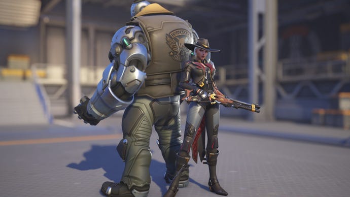 Ashe, a hero in Overwatch 2, poses before the camera in the hero selection screen.