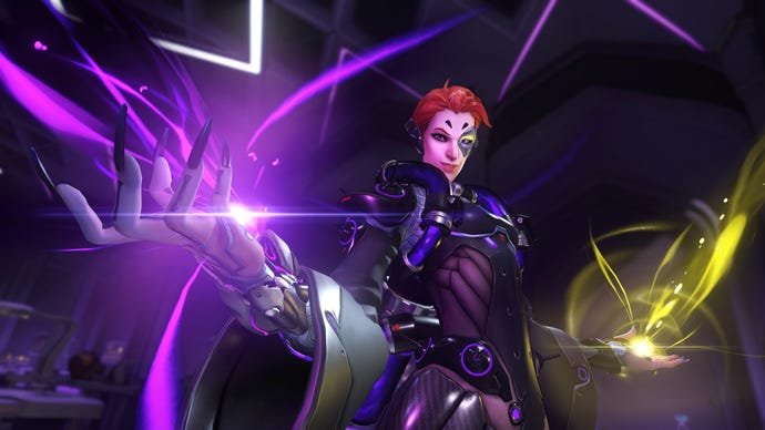 Moira, a hero in Overwatch 2, poses in front of the camera. One hand is spawning damaging magic, the other hand spawning healing magic.
