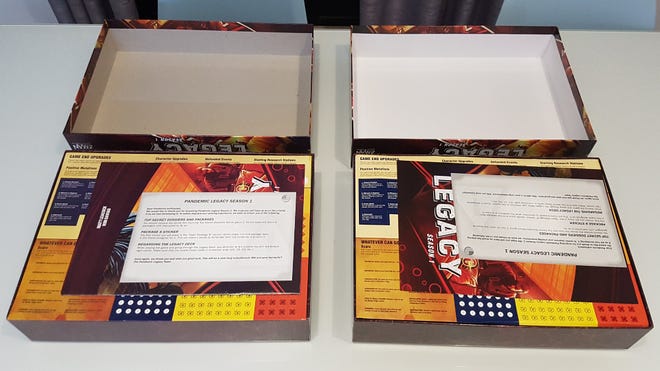 A counterfeit and real copy of board game Pandemic Legacy: Season 1 side-by-side