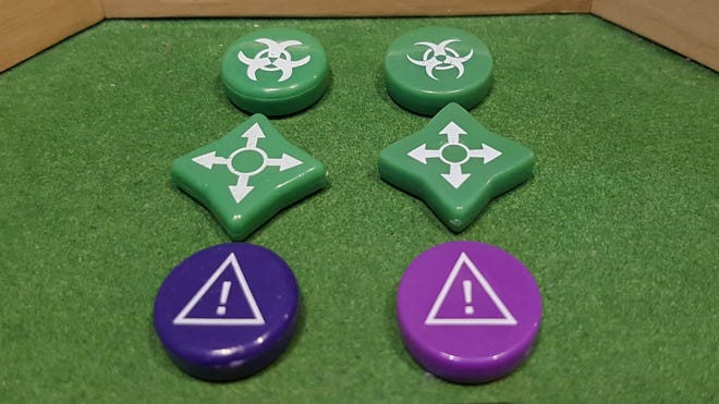 A counterfeit and real copy of board game Pandemic Legacy: Season 1 side-by-side