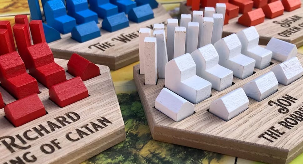 An image of personalised Catan token holders.