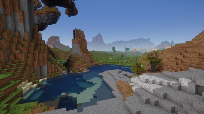 A small river cuts through a rocky Minecraft landscape.