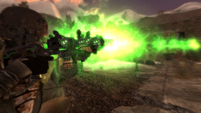 A man fires a green energy ray out of a gun in the Project Nevada mod in Fallout: New Vegas