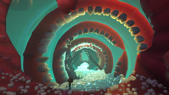 Raz walks through a tunnel of teeth in Psychonauts 2