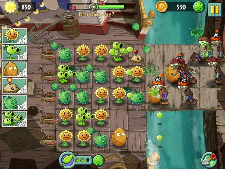 Screenshot of Plants vs. Zombies 2 showing a field of plants fending off a handful of zombies wearing traffic cones on their heads