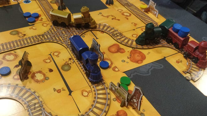 A photo of a prototype for the Railroad Madness board game.